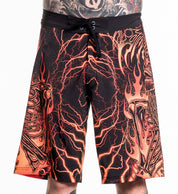 Infernal Nightmare Boardshort with black and orange fiery skeleton design, 92% polyester, 8% spandex, size 32 modeled.