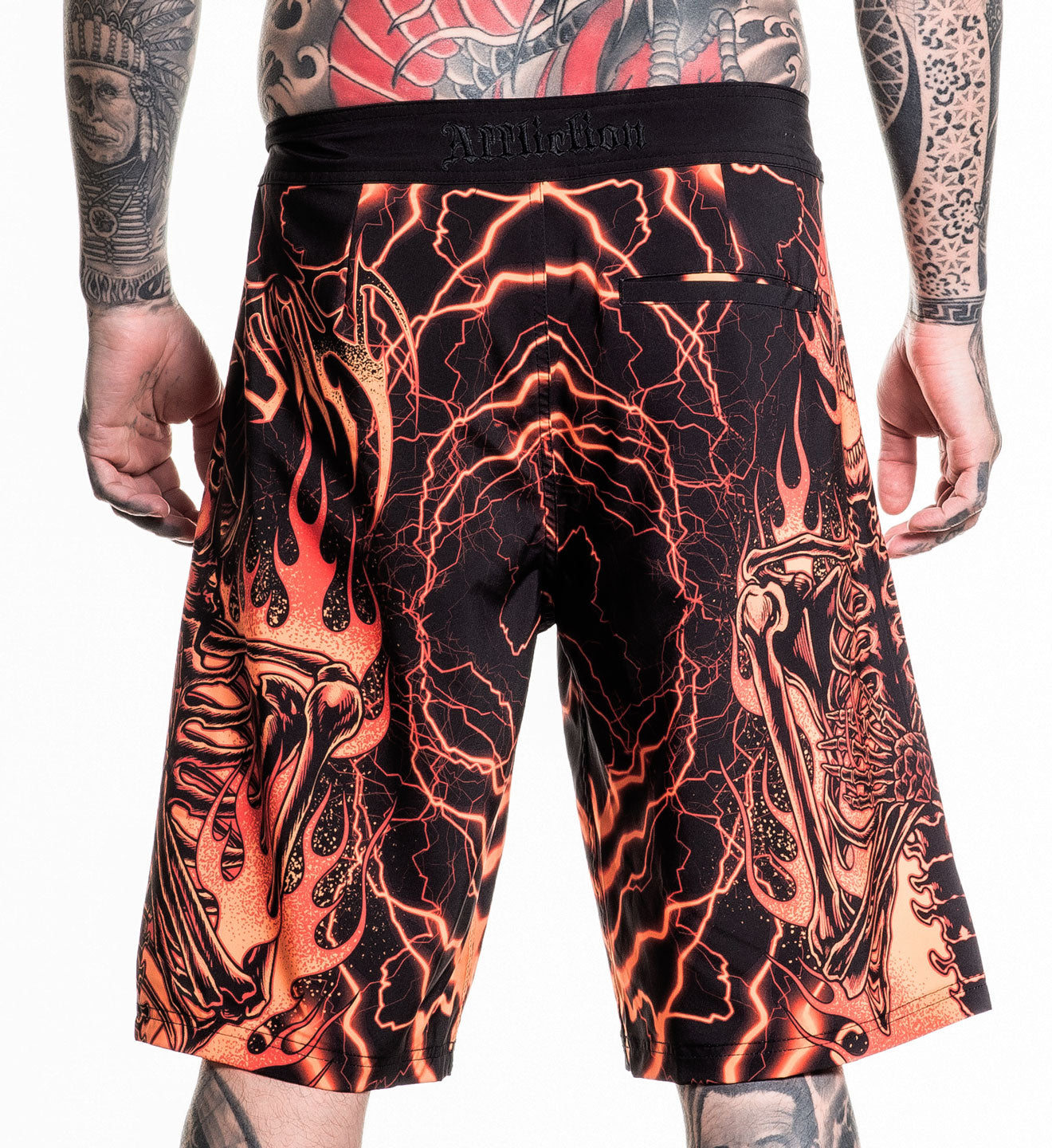 Infernal Nightmare Boardshort featuring fiery skeleton design with 92% polyester 8% spandex 4 way stretch fabric in size 32