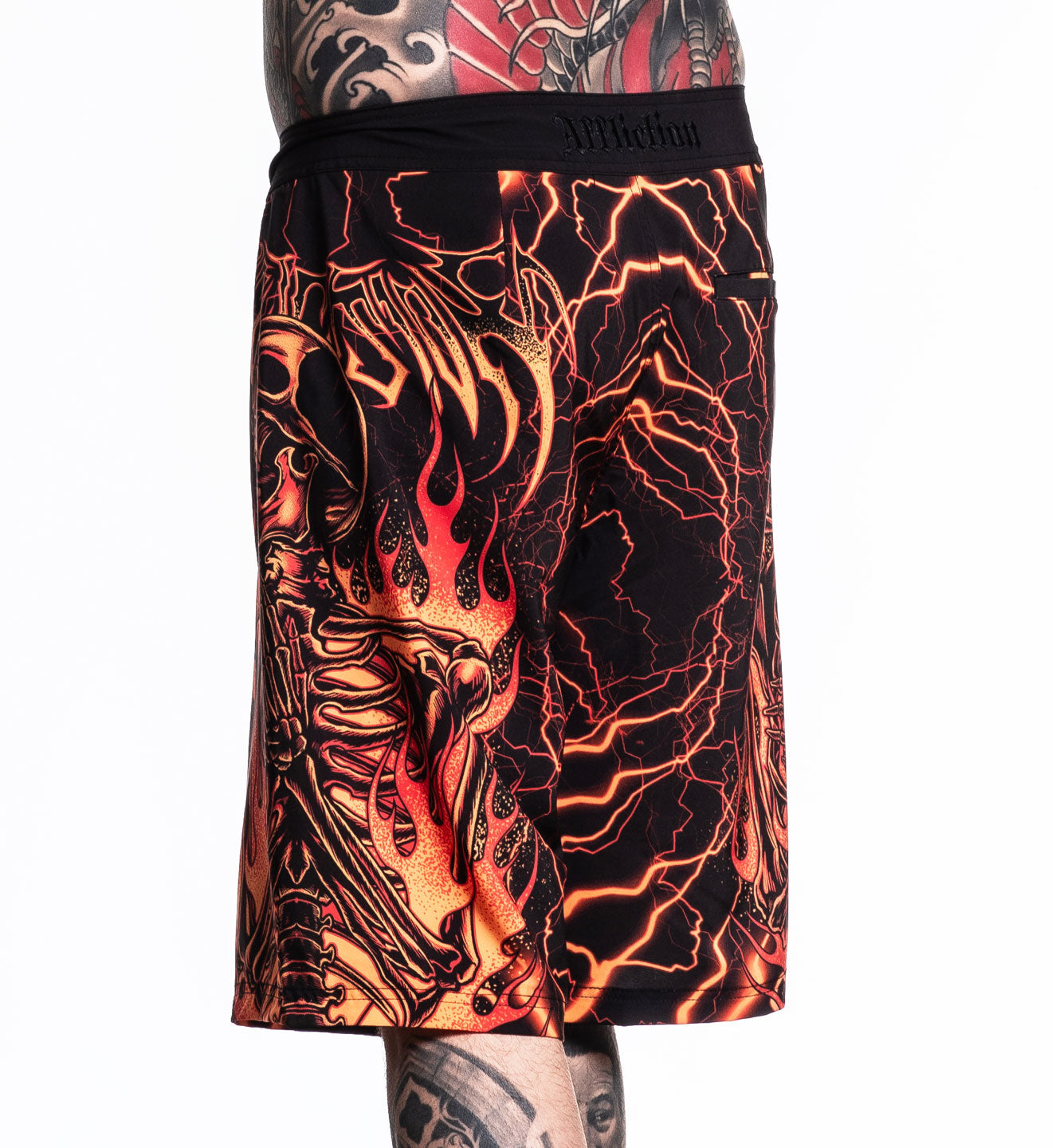 Infernal Nightmare Boardshort featuring fiery skeleton and lightning design made of 92% polyester 8% spandex stretch fabric.