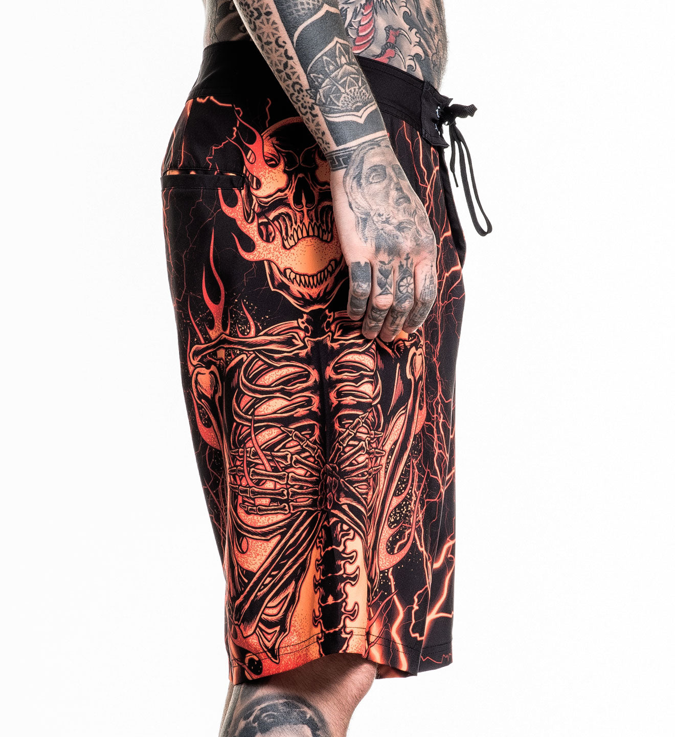 Infernal Nightmare Boardshort featuring fiery skeleton design in 92% polyester 8% spandex with 4 way stretch fabric.