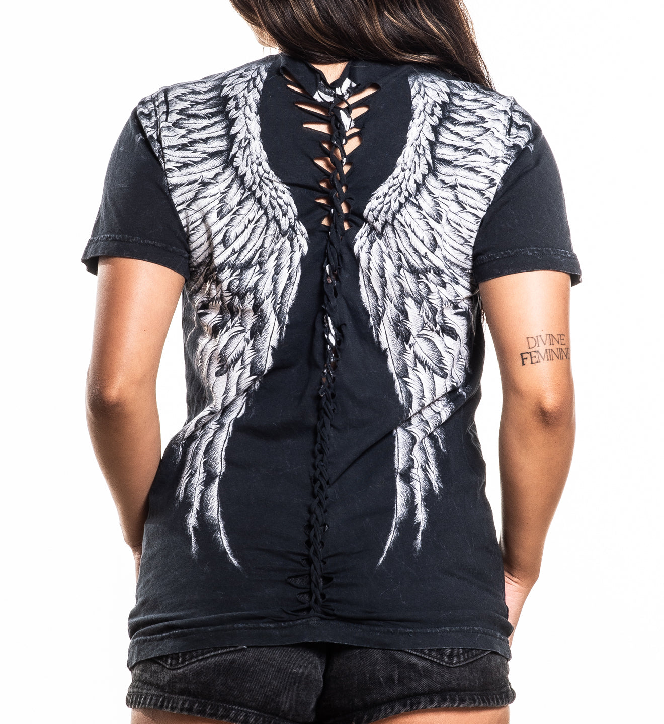 Tribal Scream Top black cotton tee with white wing print and deep braided detail on back worn by model size Small